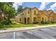 Lovely townhome with a terracotta roof, landscaped yard, and convenient parking at 7638 Long Island Dr, Kissimmee, FL 34747
