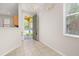 Bright foyer with tiled floor and a view of the arched entryway at 7638 Long Island Dr, Kissimmee, FL 34747