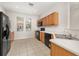 The kitchen has ample cabinet space, a black oven, dishwasher and microwave at 7638 Long Island Dr, Kissimmee, FL 34747