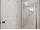 Bright laundry room with white washer and dryer at 7638 Long Island Dr, Kissimmee, FL 34747
