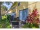 Cozy outdoor patio with seating, leading to sliding glass doors at 7638 Long Island Dr, Kissimmee, FL 34747