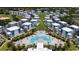 Aerial of community with a resort style pool, townhomes, and green spaces at 7920 Draw St, Reunion, FL 34747