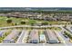 Aerial shot featuring the community's layout, amenities, and proximity to nearby golf course, enhancing its appeal and lifestyle at 7920 Draw St, Reunion, FL 34747