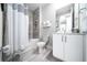 The bathroom has a vanity with cabinets, toilet, shower, and bathtub combination at 7920 Draw St, Reunion, FL 34747