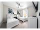 Charming bedroom with twin beds, dresser, night stand, ceiling fan, and tv at 7920 Draw St, Reunion, FL 34747