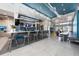 Spacious clubhouse featuring a sleek bar area, ample seating, and stylish décor at 7920 Draw St, Reunion, FL 34747
