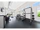 Well-equipped fitness center with modern exercise equipment and ample natural light at 7920 Draw St, Reunion, FL 34747