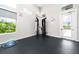 On-site gym with fitness equipment, natural light, and easy access to outdoors at 7920 Draw St, Reunion, FL 34747