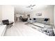 Spacious living room showcasing an open layout, stylish decor, and modern furnishings for comfortable living at 7920 Draw St, Reunion, FL 34747