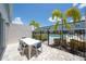 Private patio area features a dining table, pavers, and access to the community pool at 7920 Draw St, Reunion, FL 34747
