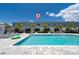 Resort-style pool with lounge chairs and lush landscaping enhances this building's appeal at 7920 Draw St, Reunion, FL 34747