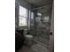 Bathroom with a walk-in shower with glass door and a large vanity area at 7971 Brofield Ave, Windermere, FL 34786