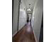 Hallway featuring sliding barn doors, hardwood floors, recessed lighting, and access to other rooms at 7971 Brofield Ave, Windermere, FL 34786