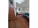 Inviting living area featuring hardwood floors, a staircase, and stylish decor at 7971 Brofield Ave, Windermere, FL 34786