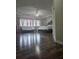 Spacious main bedroom with wood floors, a ceiling fan, and bright, natural light at 7971 Brofield Ave, Windermere, FL 34786