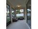 Enclosed porch with outdoor seating area at 7971 Brofield Ave, Windermere, FL 34786