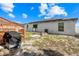 Spacious backyard with a patio area, grill, solar panels and lots of potential for customization at 8 Orchid Ct, Kissimmee, FL 34759