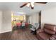 Cozy living room featuring sleek wood floors, a comfortable seating area, and an open layout at 8 Orchid Ct, Kissimmee, FL 34759