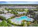 Aerial view showcasing a large resort style pool with community amenities at 816 Longboat Dr, Davenport, FL 33896