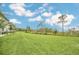 A vast green lawn offers ample space for recreation and outdoor activities, perfect for leisure and entertainment at 816 Longboat Dr, Davenport, FL 33896
