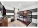 Modern bedroom with a bunk bed, TV, and a black and white striped accent wall at 816 Longboat Dr, Davenport, FL 33896