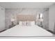 Bright bedroom features a king bed, neutral decor, carpet, and matching lamps at 816 Longboat Dr, Davenport, FL 33896