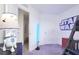 Star Wars themed bedroom with R2D2 lamp and lightsaber, showcasing a fun and imaginative space at 816 Longboat Dr, Davenport, FL 33896