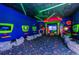 Colorful entertainment space with gaming consoles, bean bag chairs, and a vibrant, playful atmosphere at 816 Longboat Dr, Davenport, FL 33896