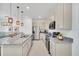Bright kitchen offers stainless steel appliances, granite countertops, and sleek cabinetry at 816 Longboat Dr, Davenport, FL 33896