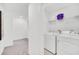 Convenient laundry area with modern washer and dryer, plus ample storage space at 816 Longboat Dr, Davenport, FL 33896