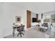 Bright living area features an office nook, wood accent wall, modern furniture, and stylish decor at 816 Longboat Dr, Davenport, FL 33896