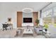 Comfortable living room featuring modern lighting, a wall-mounted TV, sleek furniture and a striped rug at 816 Longboat Dr, Davenport, FL 33896