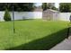 Fenced backyard with ample green space and a storage shed, providing room for activities and storage at 10722 Clover Walk Dr, Orlando, FL 32825