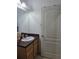 Bright bathroom featuring a vanity with generous counter space and modern lighting fixtures at 10722 Clover Walk Dr, Orlando, FL 32825