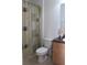 Functional bathroom featuring a shower, toilet, and vanity with storage, designed for convenience at 10722 Clover Walk Dr, Orlando, FL 32825