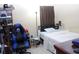 Bedroom with a full bed, desk, and gaming chair in a cozy setting, complete with neutral walls and a minimalist design at 10722 Clover Walk Dr, Orlando, FL 32825