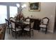 Traditional dining room with seating for six, elegant chandelier, and classic furnishings at 10722 Clover Walk Dr, Orlando, FL 32825