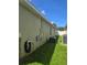 House exterior with air conditioning units and utility connections, ensures efficient climate control and convenience at 10722 Clover Walk Dr, Orlando, FL 32825
