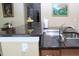 Kitchen showcases granite counters, stainless sink and gooseneck faucet at 10722 Clover Walk Dr, Orlando, FL 32825