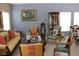 Bright living room offering comfortable seating and lots of light from windows at 10722 Clover Walk Dr, Orlando, FL 32825