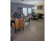 Elegant living room featuring classic furniture, tile flooring and natural light from large windows at 10722 Clover Walk Dr, Orlando, FL 32825