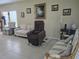 Inviting living room features tile flooring, comfortable seating, and natural light at 10722 Clover Walk Dr, Orlando, FL 32825
