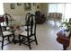 Inviting living room features tile flooring, natural light, and ample space for furniture and decor at 10722 Clover Walk Dr, Orlando, FL 32825