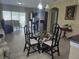 Spacious living area combines dining and living spaces with tile flooring and natural light at 10722 Clover Walk Dr, Orlando, FL 32825
