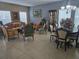 Elegant living room boasts tile floors, natural light, and plenty of space for entertaining guests at 10722 Clover Walk Dr, Orlando, FL 32825