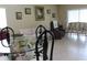 Living room with comfortable sofas, elegant dining set, and natural light from the window at 10722 Clover Walk Dr, Orlando, FL 32825