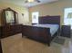 The main bedroom features a bed with traditional furnishings, providing a comfortable and stylish retreat at 10722 Clover Walk Dr, Orlando, FL 32825