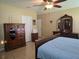 The main bedroom features traditional furnishings, neutral tones, and plenty of storage at 10722 Clover Walk Dr, Orlando, FL 32825