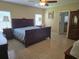 Spacious main bedroom features traditional furnishings, neutral tones, and plenty of natural light at 10722 Clover Walk Dr, Orlando, FL 32825