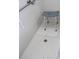 Accessible tiled shower with safety grab bar and seat, ensuring a comfortable and secure experience at 10722 Clover Walk Dr, Orlando, FL 32825